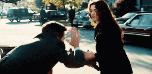 lady-hitting-a-man-with-her-bag.gif