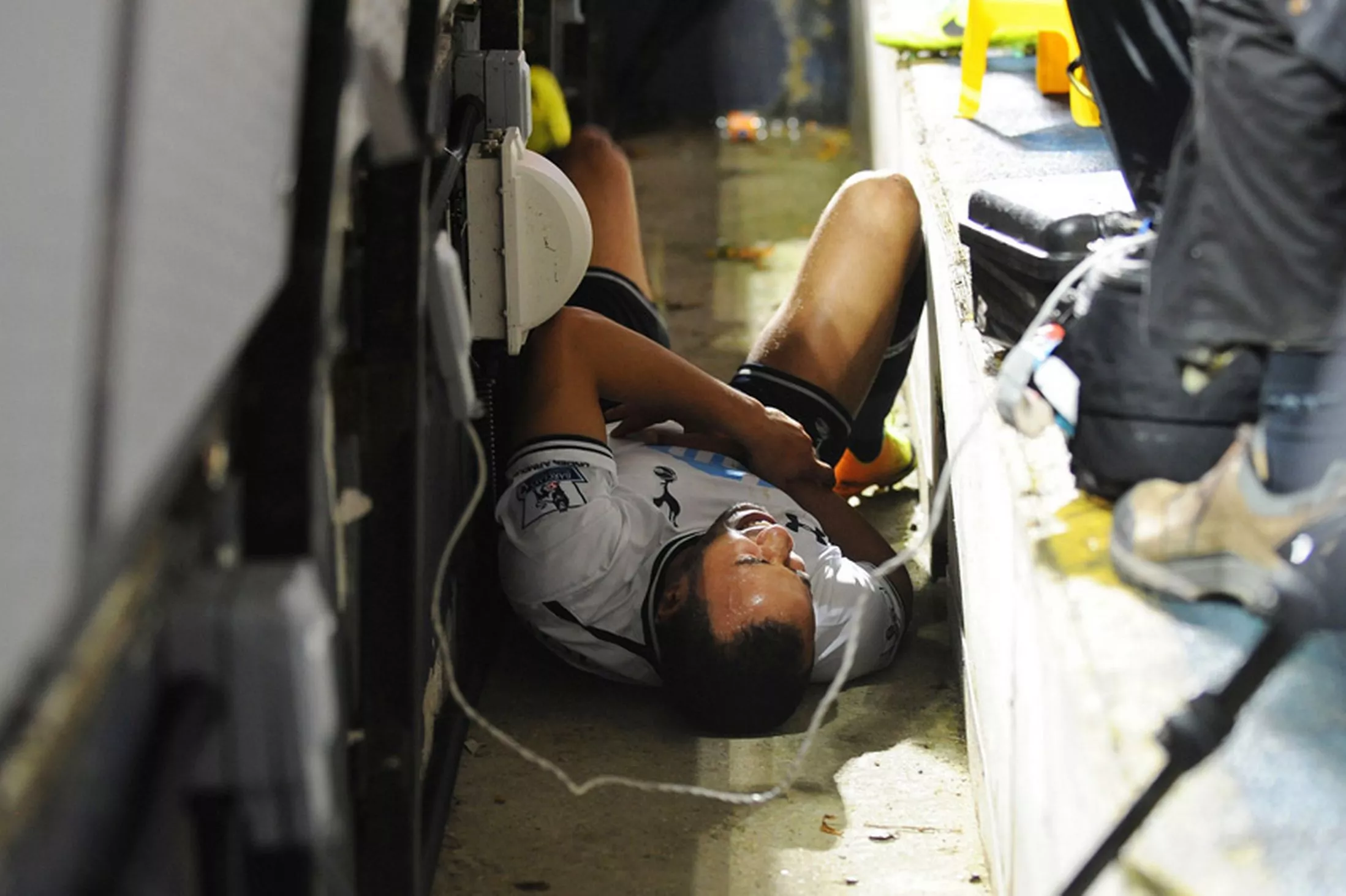 Andros-Townsend-of-Tottenham-Hotspur-lies-injured-after-falling-into-the-photographers-pit.png
