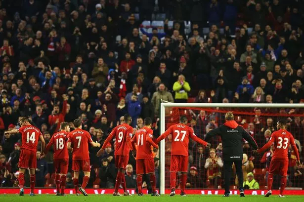 Jurgen-Klopp-manager-of-Liverpool-and-player-salute-The-Kop-after-the-Barclays-Premier-League-match-between-Liverpool.jpg