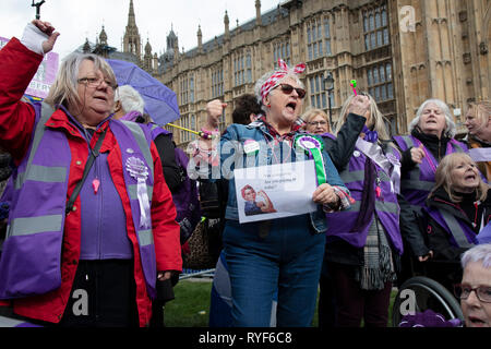 waspi-women-protest-joins-in-the-anti-brexit-demonstration-after-breaking-through-the-barriers-onto-college-green-in-westminster-on-the-day-after-the-meaningful-vote-when-mps-again-rejected-the-prime-ministers-brexit-withdrawal-agreement-and-before-a-vote-on-removing-the-possibility-of-a-no-deal-brexit-on-13th-march-2019-in-london-england-united-kingdom-women-against-state-pension-inequality-is-a-voluntary-uk-based-organisation-founded-in-2015-that-campaigns-against-the-way-in-which-the-state-pension-age-for-men-and-women-was-equalised-they-call-for-the-millions-of-women-affected-by-the-ryf6c8.jpg