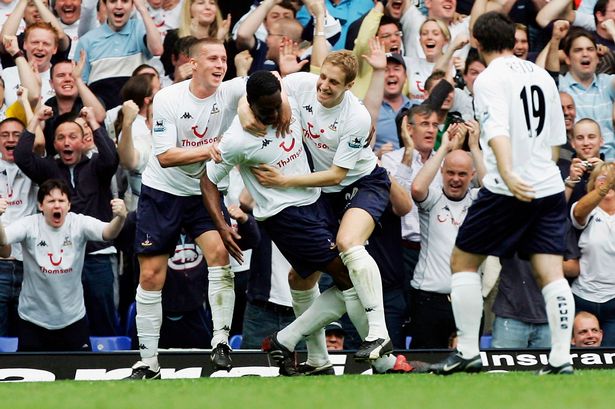 Ledley%20King%20is%20mobbed%20by%20his%20team%20mates%20after%20scoring%20their%20second%20goal%20during%20against%20Aston%20Villa%20on%20May%201,%202005-1149701