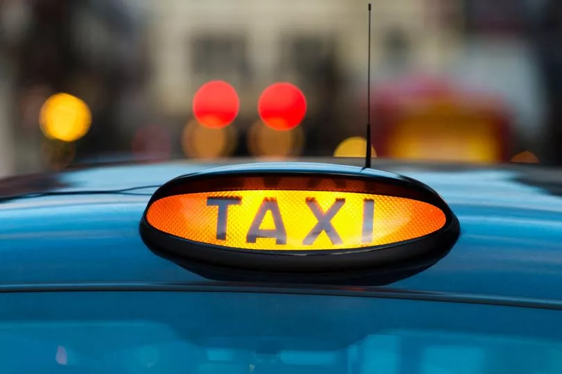 0_UK-England-London-Sign-on-taxi-cab.jpg