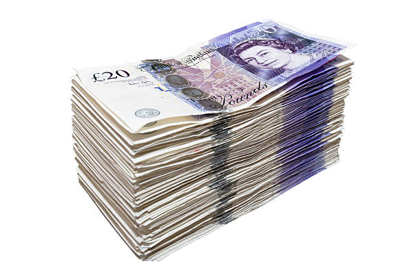 stack-of-twenty-pound-notes-picture-id458136145